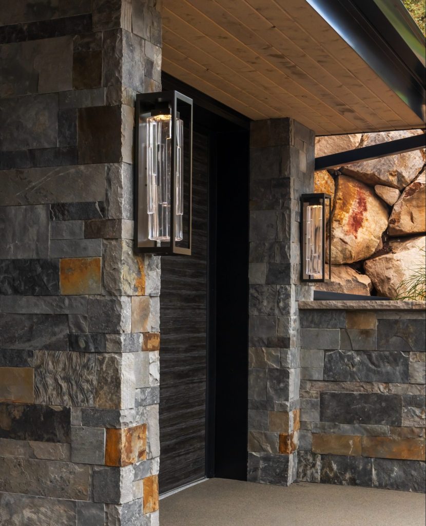 Hammerton Studio Maison Ledgstone outdoor wall sconces on architectural stone exterior
