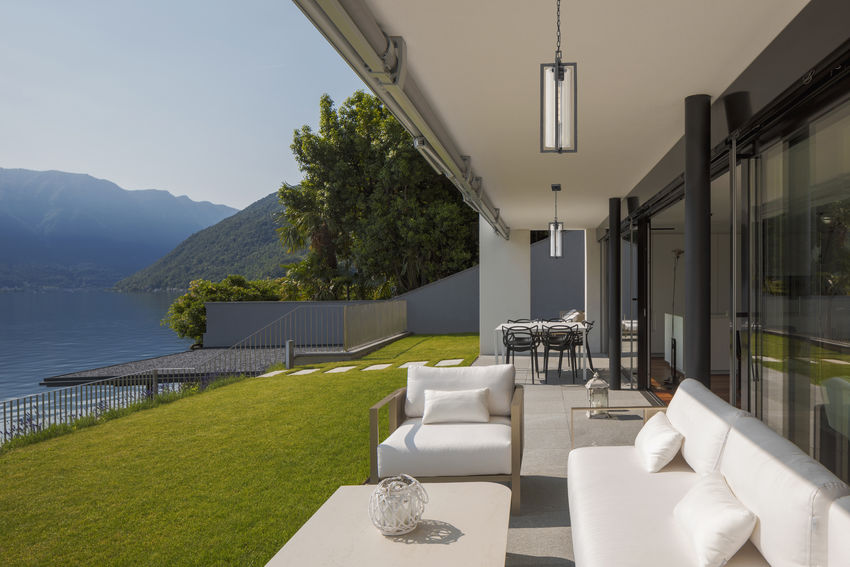 Z-Lite Aura Outdoor Hanging Light installed on a home exterior