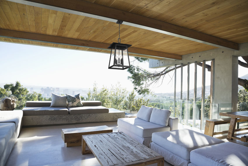 Z-Lite Rainer Outdoor Hanging Light installed on a home exterior