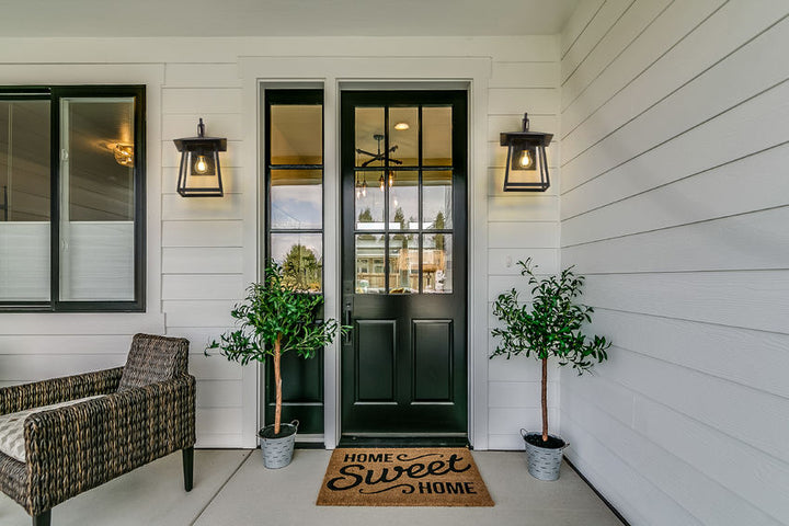 Z-Lite Rainer Outdoor Wall Light installed on a home exterior