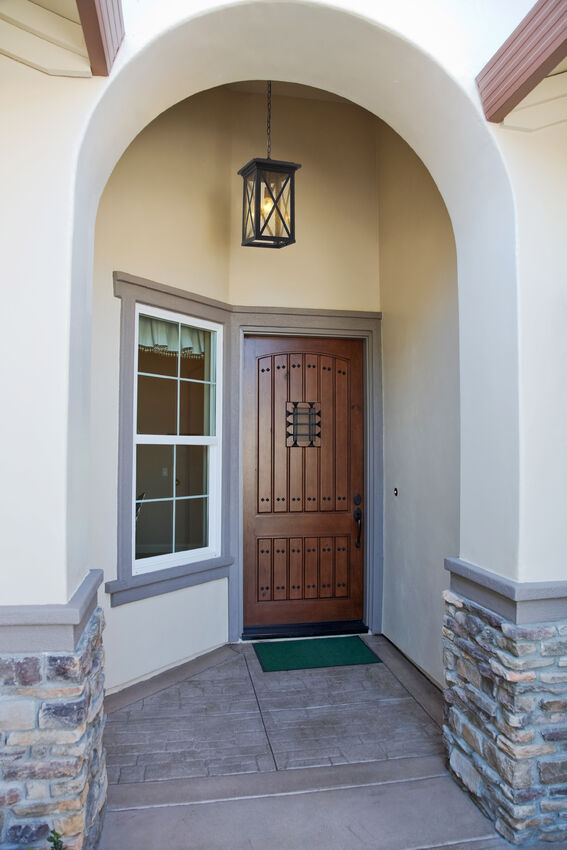 Z-Lite Brookside Outdoor Hanging Light installed on a home exterior