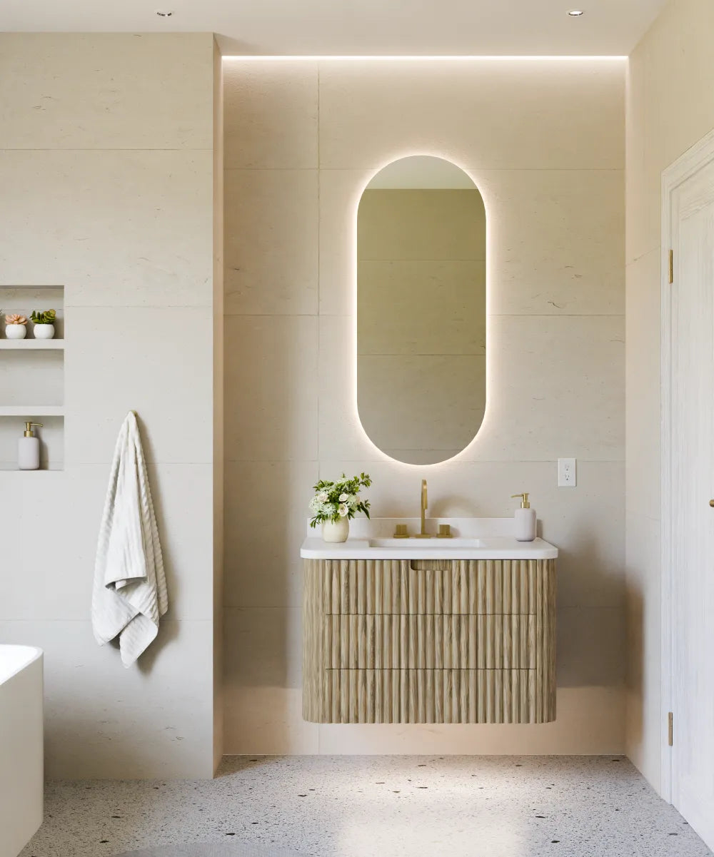Electric Mirror Ellura capsule LED lighted mirror over Monterey vanity