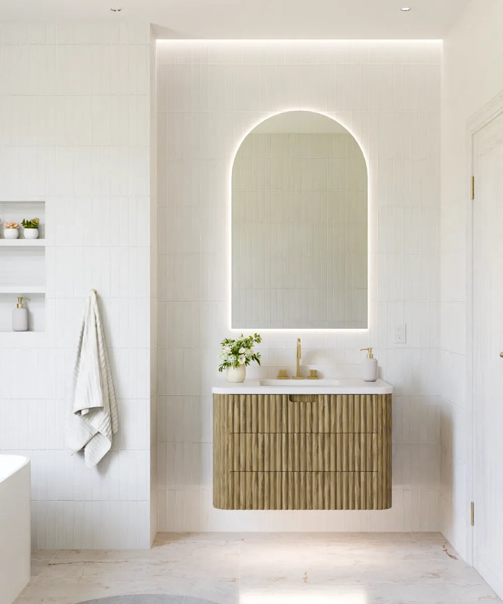 Electric Mirror Pinnacle arched LED lighted mirror over Monterey vanity