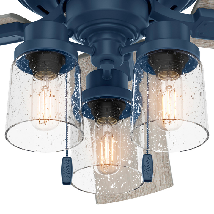 Hunter 52 inch Hartland Low Profile Ceiling Fan with LED Light Kit and Pull Chain Indoor Ceiling Fans Hunter Indigo Blue Light Gray Oak / Clear Seeded